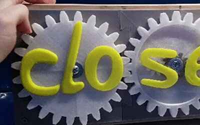 Designer Figures Out How to Perfect That Transforming "Open/Closed" Sign